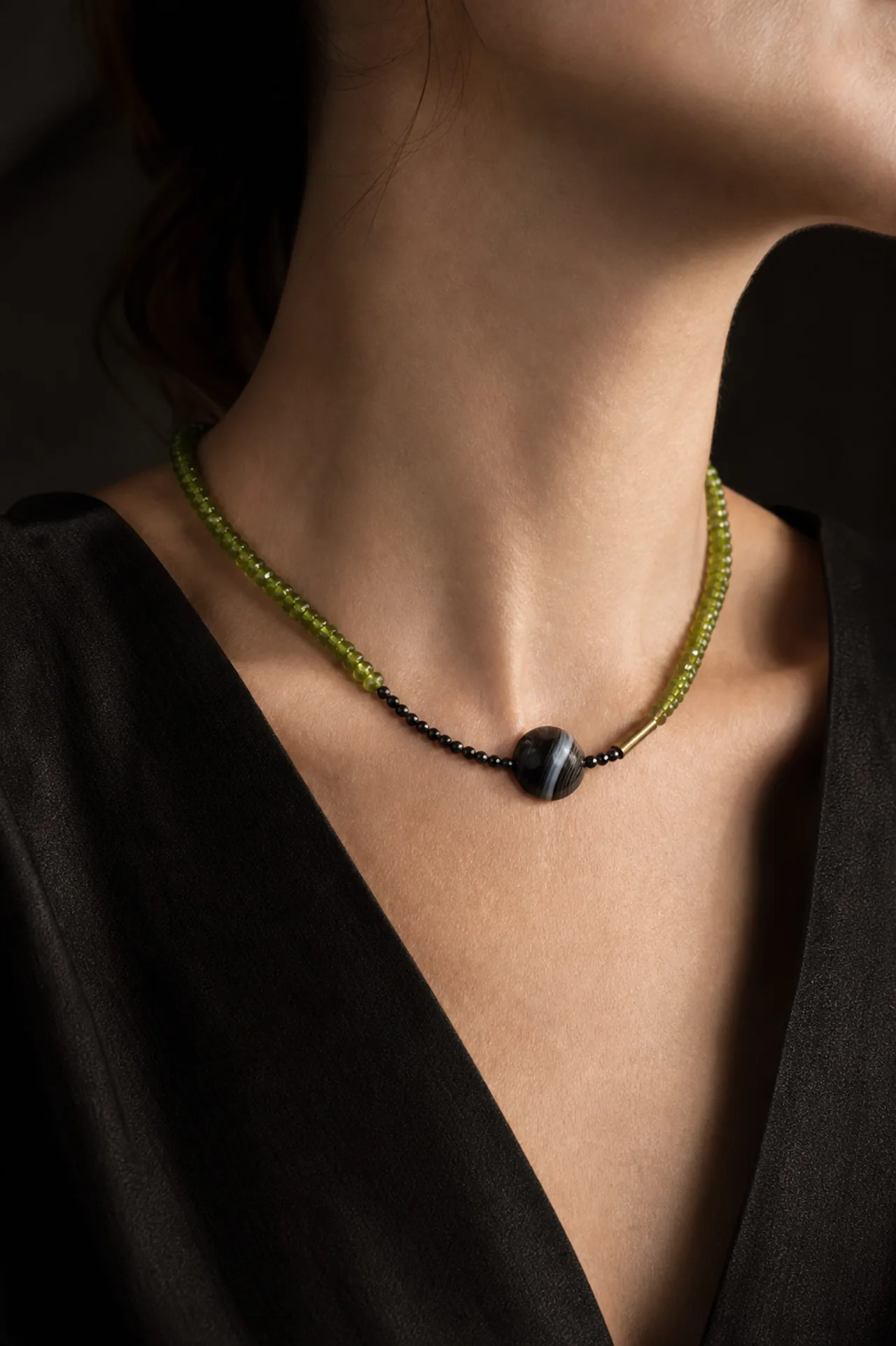 The Green Flash Collar worn at the collarbone